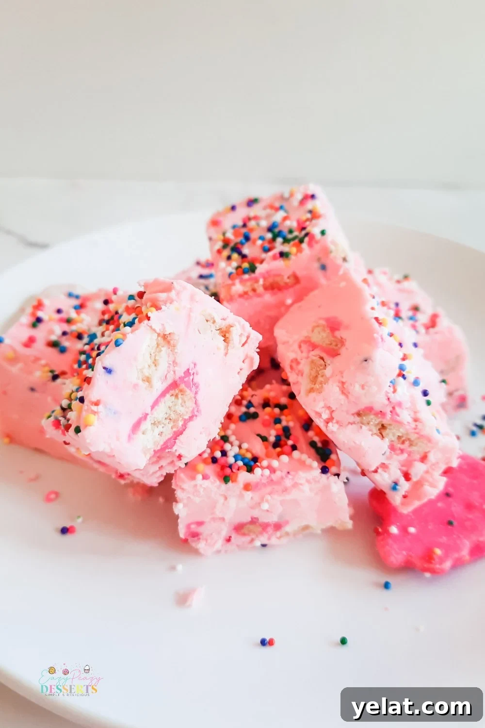 Funfetti Strawberry Fudge Recipe: Creamy, Festive Candy 3 A few squares of funfetti fudge with strawberry frosting, sprinkled and circus cookies
