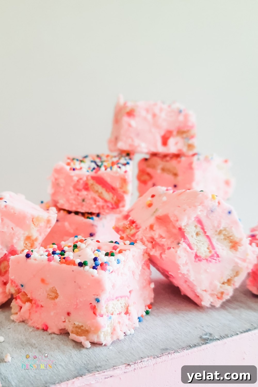 Funfetti Strawberry Fudge Recipe: Creamy, Festive Candy 5 A few squares of strawberry funfetti fudge with circus cookies