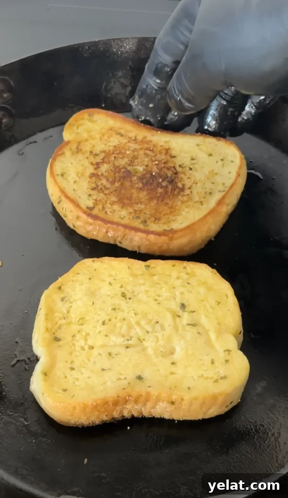 Texas Toast Bacon Cheesburgers with Melty Cheese and Crispy Bacon 3 texas toast on a griddle top
