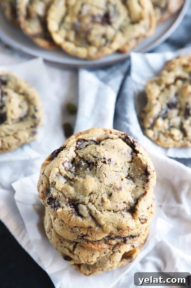 Sea Salt Pistachio Dark Chocolate Cookies Recipe 7 Overhead photo of stacked cookies with sea salt