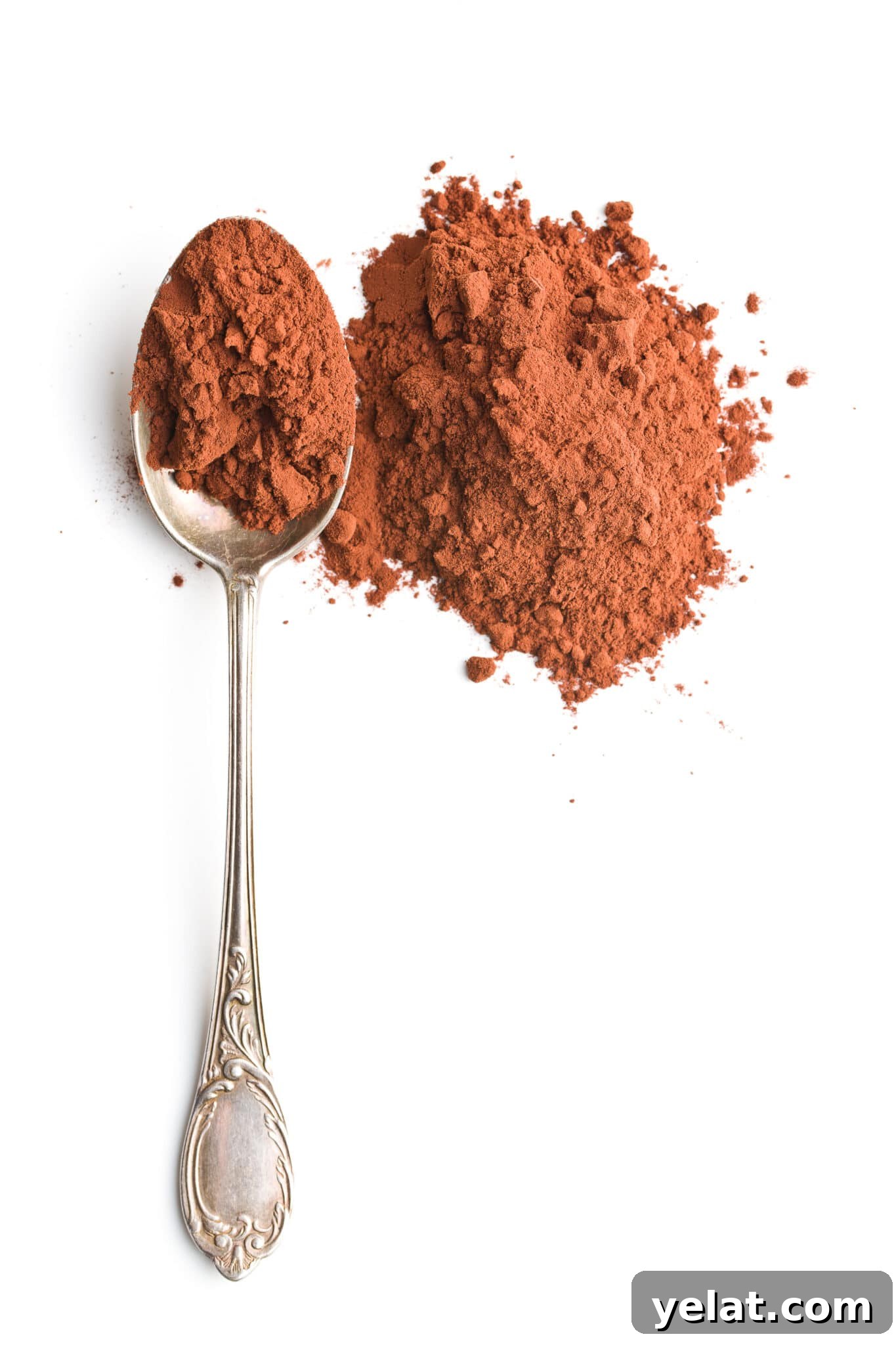 Low-Carb Pantry Essentials for Baking: Flour Substitutes & Staples 12 A spoon next to a small pile of cocoa powder.