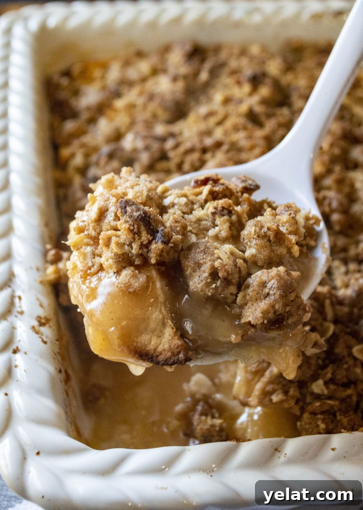 apple crisp on a serving spoon