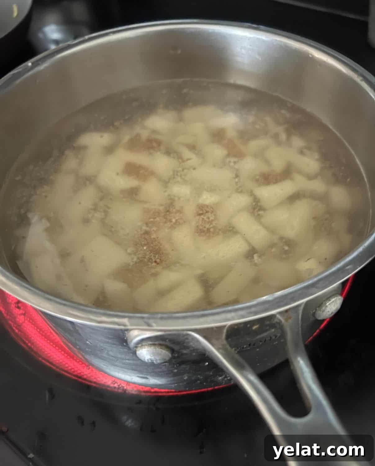 Creamy Mashed Potatoes Made with Greek Yogurt 5 Cut up potatoes boiling on a stove top.