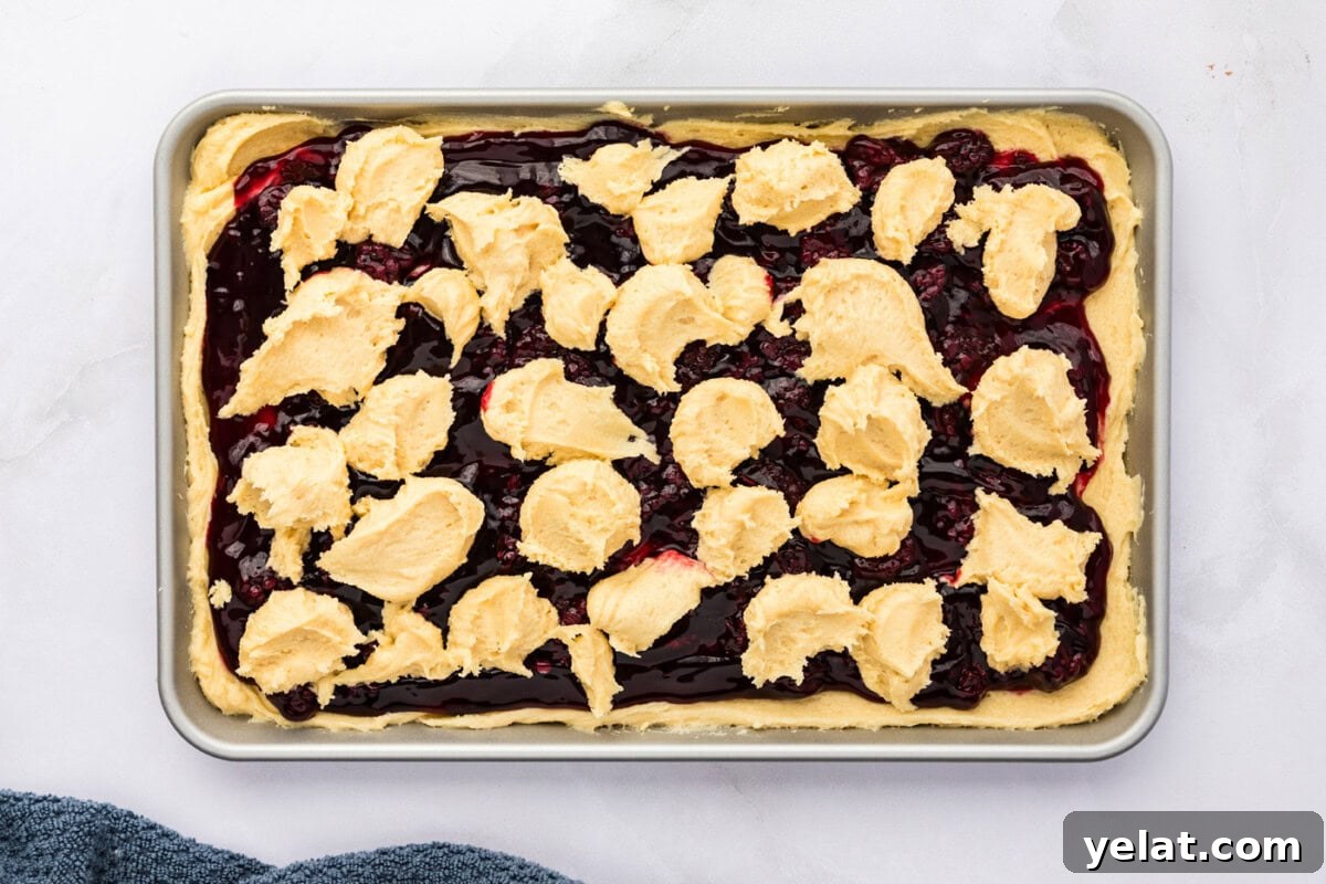 Irresistible Blackberry Pie Squares Recipe for Summer Gatherings 11 dollops of cookie dough batter on top of blackberry pie filling
