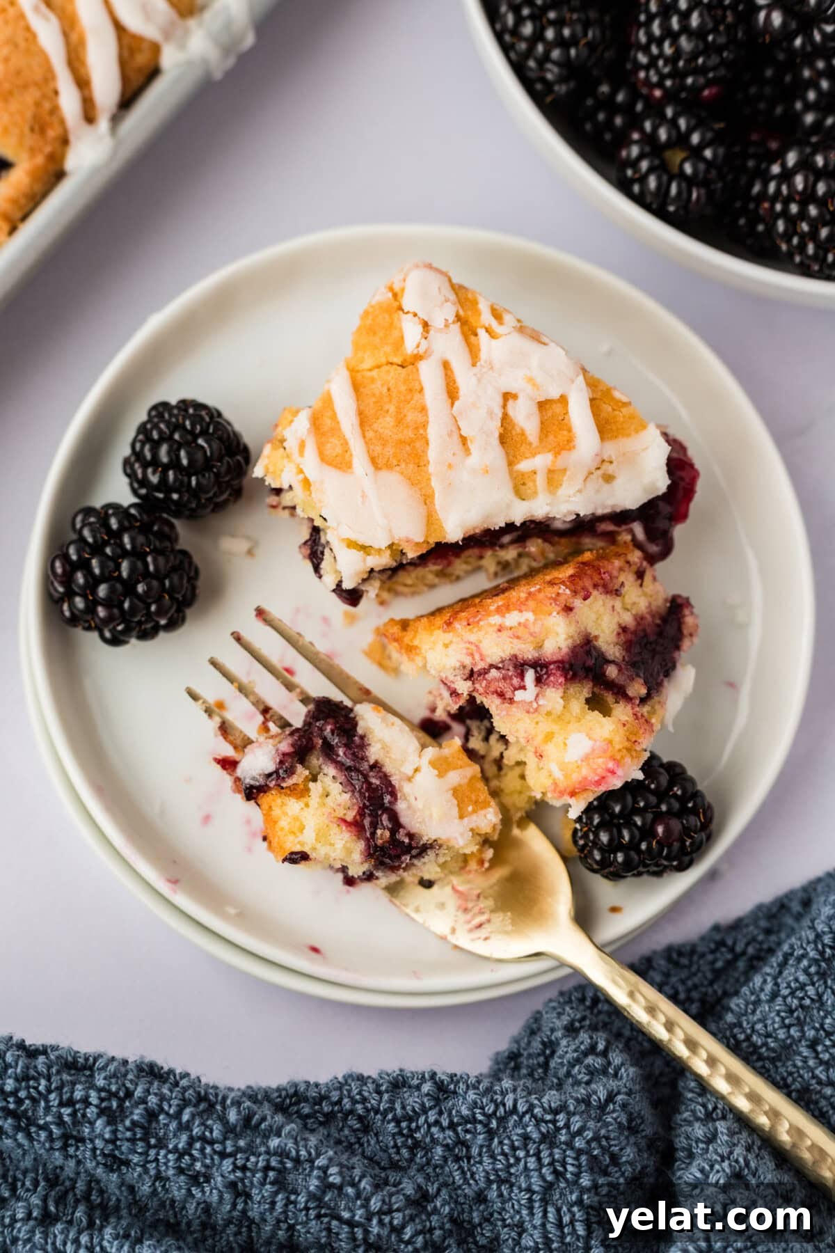 Irresistible Blackberry Pie Squares Recipe for Summer Gatherings 14 Blackberry Pie Square broken up on a plate with a fork