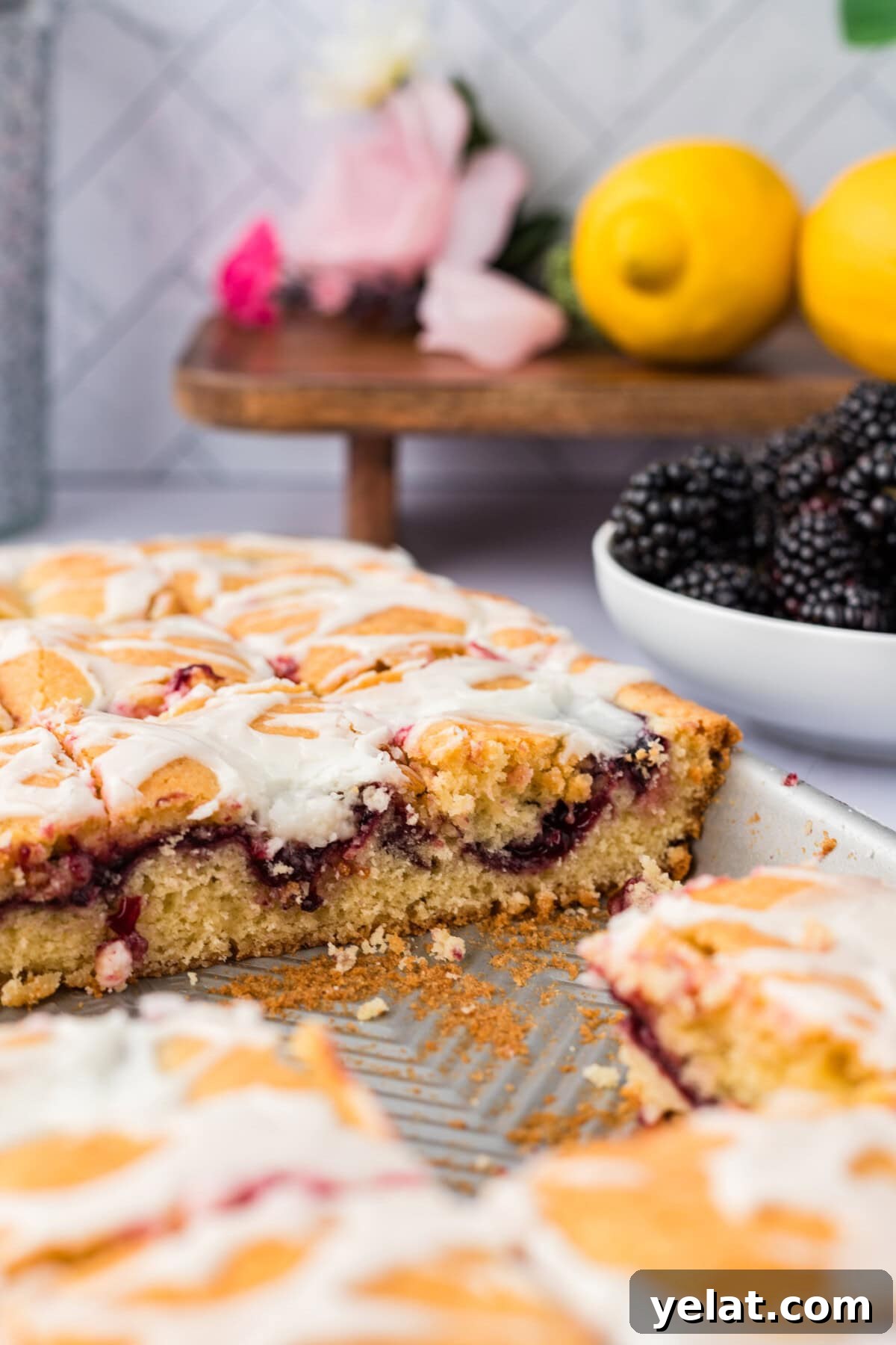 Irresistible Blackberry Pie Squares Recipe for Summer Gatherings 3 Side photo of Blackberry Pie Squares in a jelly roll pan with some removed