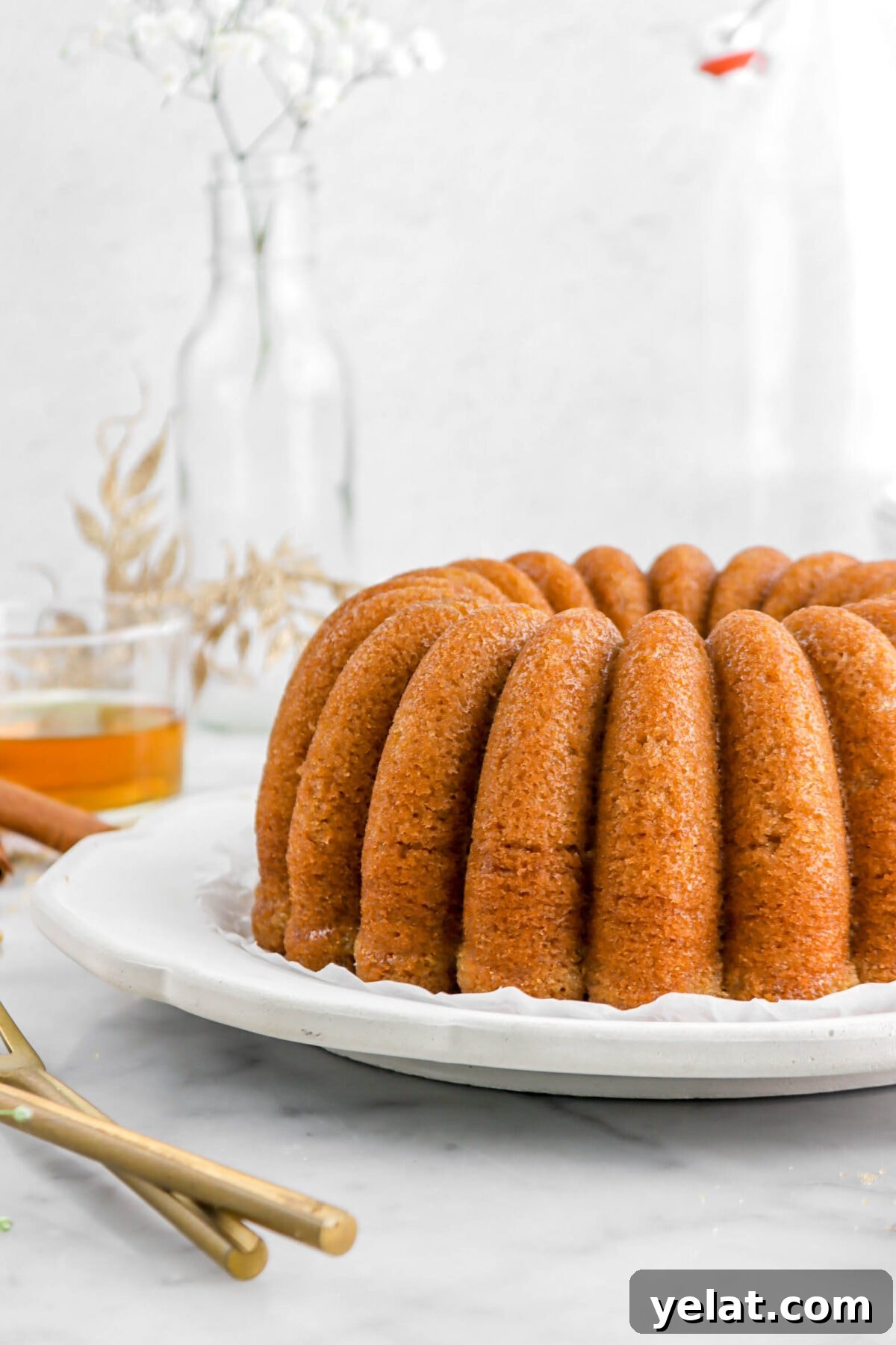 Spiced Apple Cider Bourbon Bundt Cake Recipe for Fall Desserts 3 close up of bundt cake on grey plate