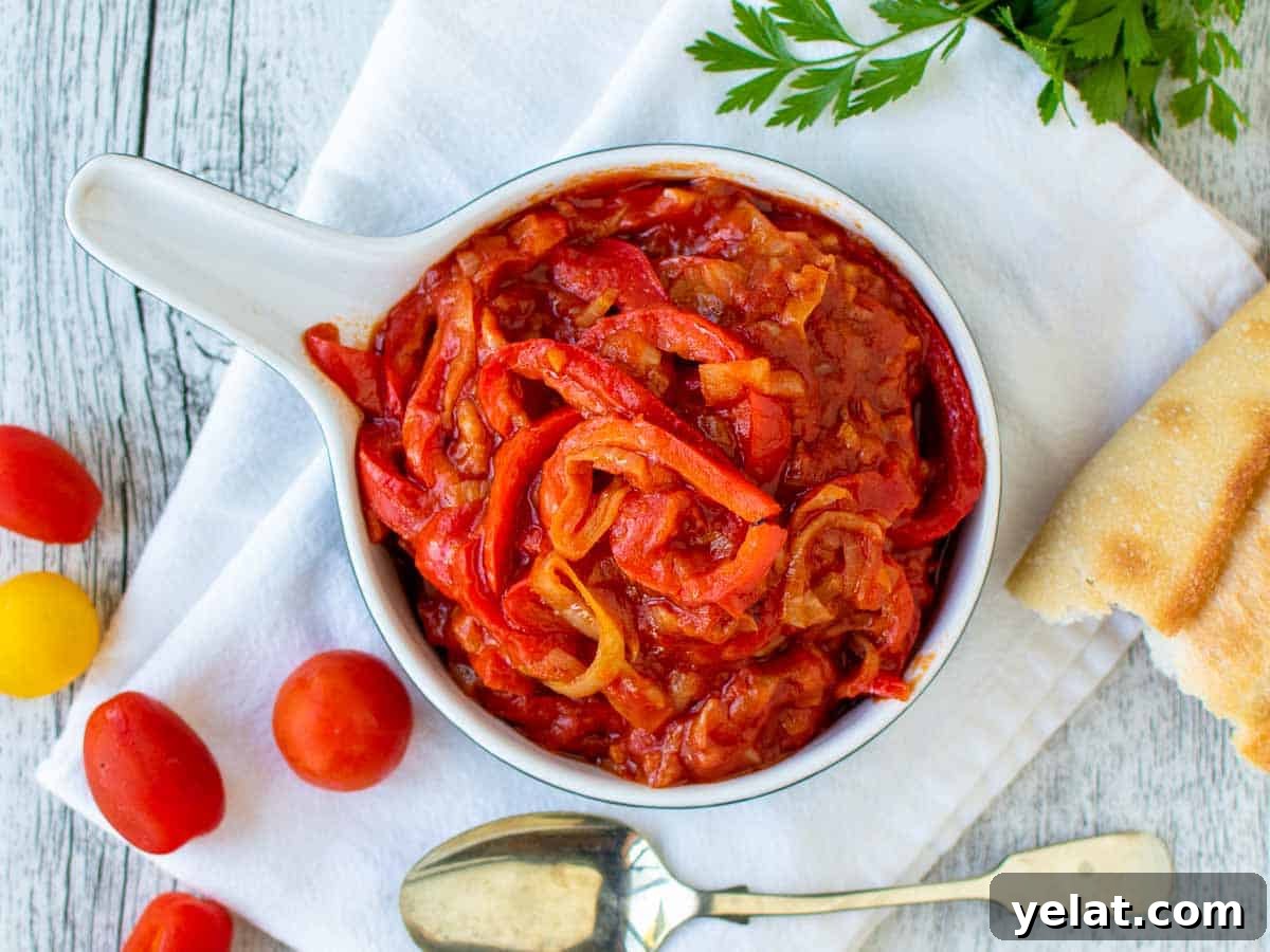 Authentic Italian Peperonata Recipe – Sweet Pepper Stew 5 Overhead view of stewed bell peppers and tomato sauce.