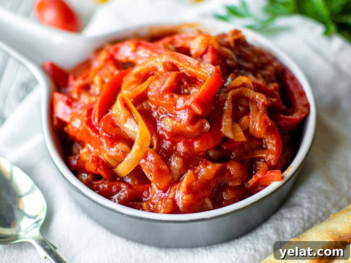 Authentic Italian Peperonata Recipe – Sweet Pepper Stew 6 Close up of stewed bell peppers in tomato sauce.