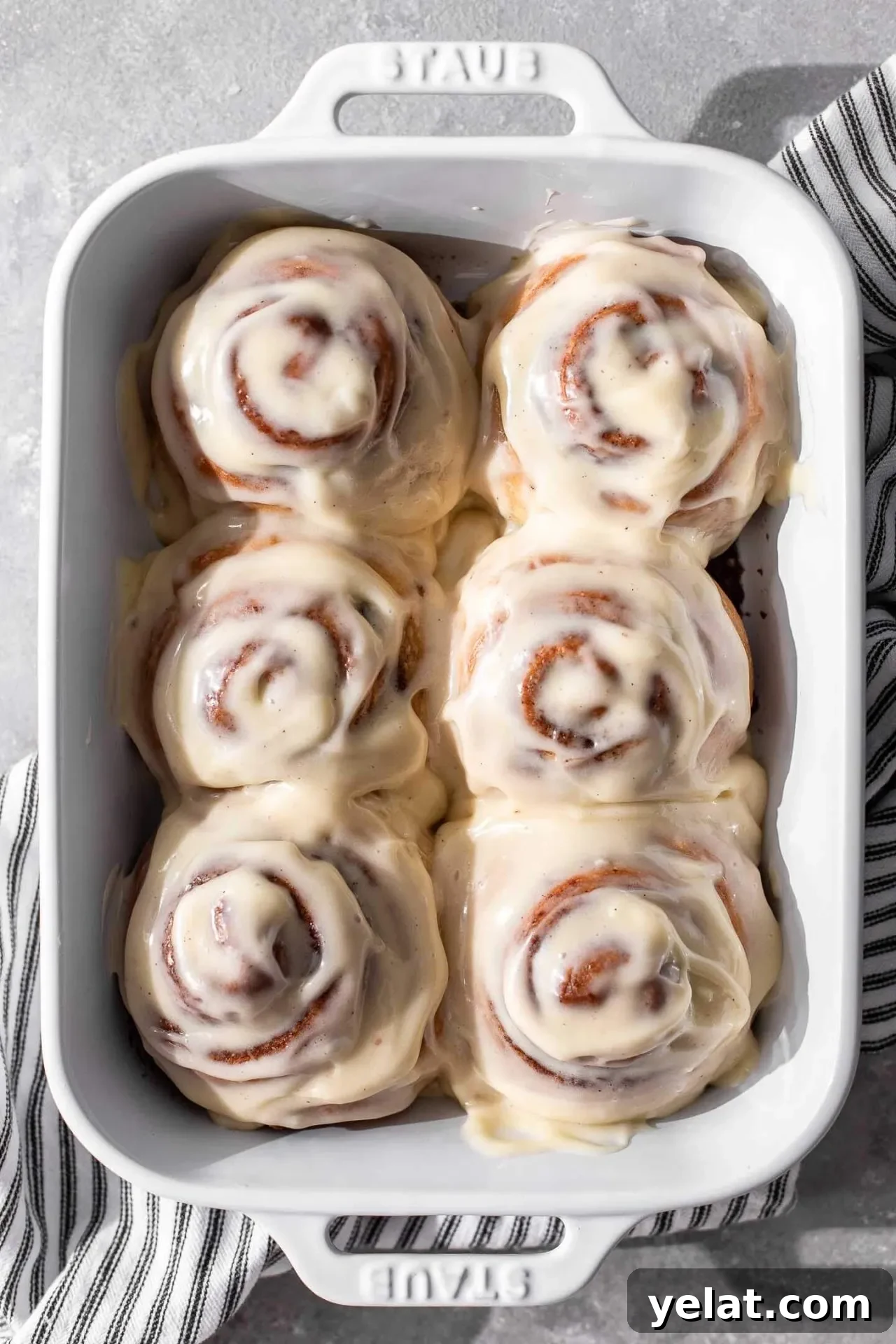 Cinnamon Rolls for Two: Small-Batch Recipe for Soft, Gooey Treats 11 baked and iced small batch cinnamon rolls in baking pan (1)
