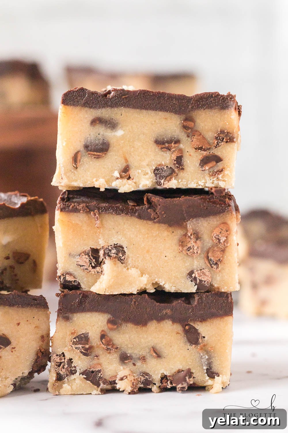 No-Bake Chocolate Chip Cookie Bars are irresistible, fun to make, and safe to eat! Simply put the bars in the refrigerator, chill, and enjoy!