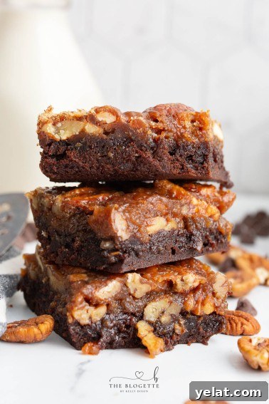 Pecan Pie Brownies are fudgy chocolate brownies topped with a pecan pie filling for an irresistible dessert. This is a Thanksgiving FAVORITE but is delicious all year long.