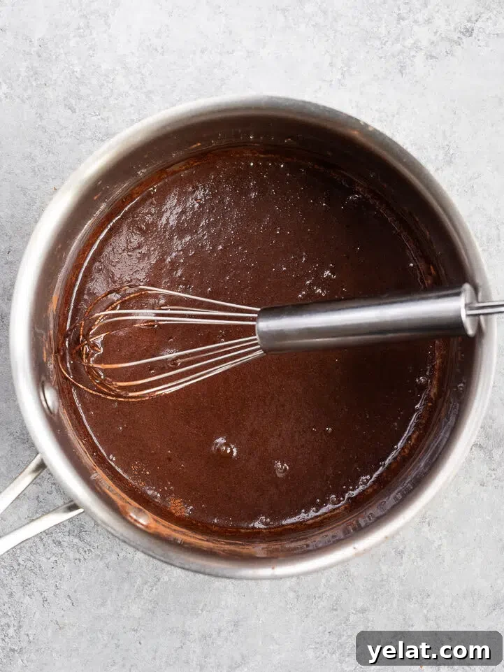 Nutritious Hot Chocolate Recipe for Cozy Winter Nights 5 mixing cocoa powder and milk in a saucepan