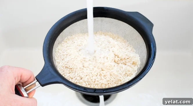 rinsing long grain white rice in colander