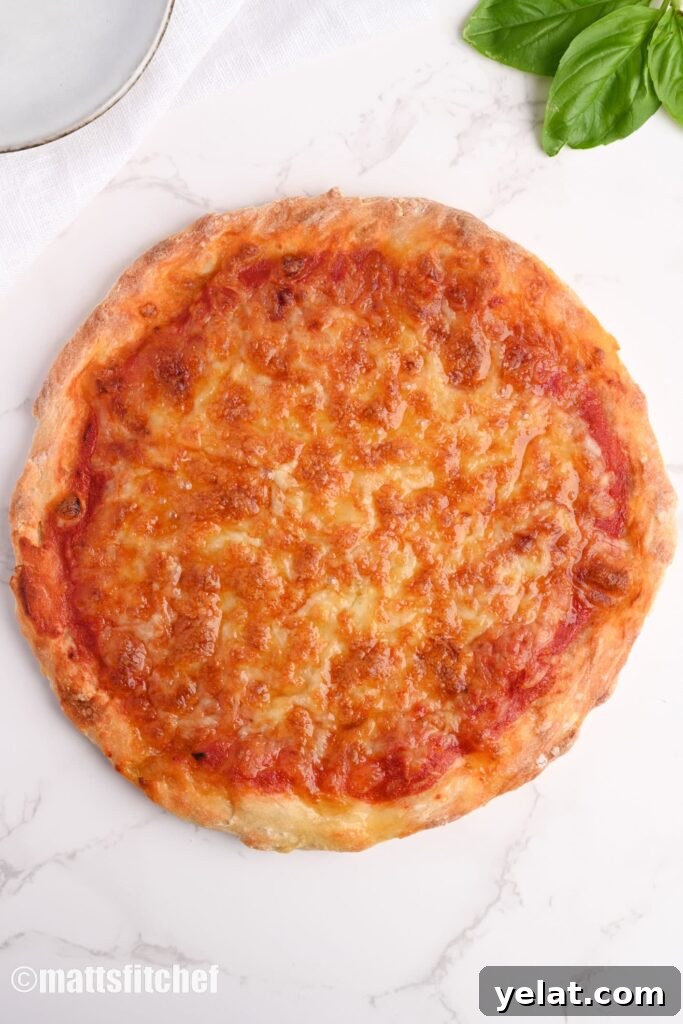 Low calorie pizza crust topped with low fat mozzarella cheese and tomato sauce