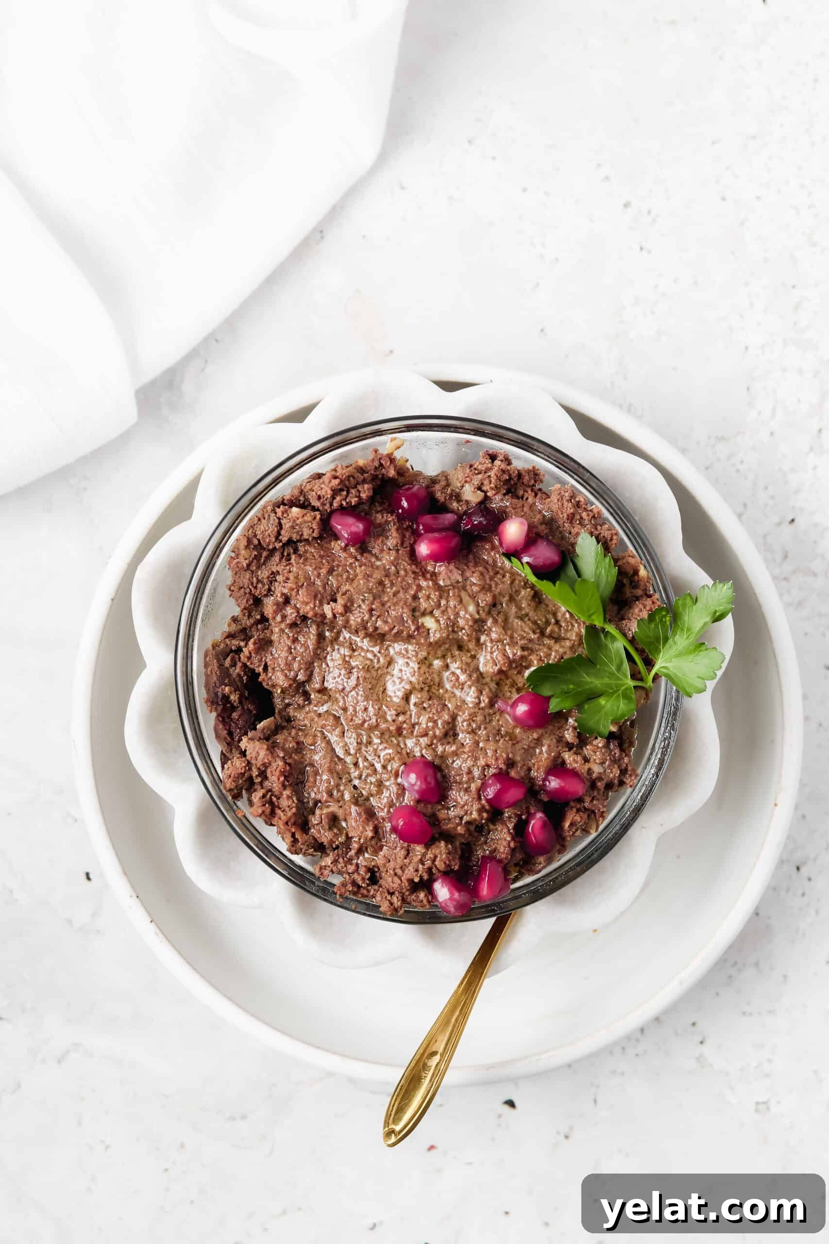 Silky Beef Liver Pâté Recipe for Entertaining and Apps 2 Beef liver pate in a flower white bowl with a gold spoon.
