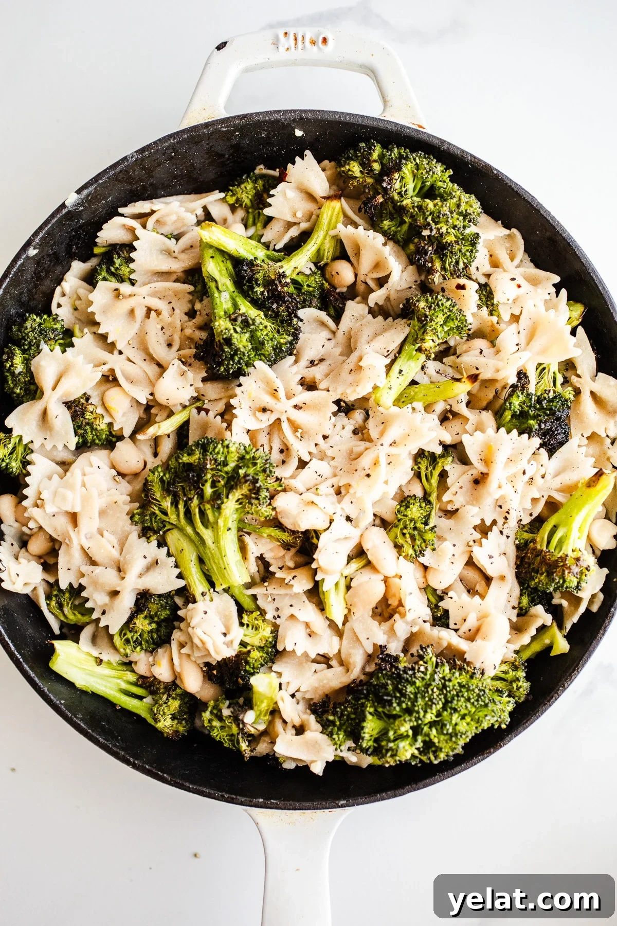 Creamy White Bean Pasta with Garlic and Herbs 2 Pasta and broccoli in a skillet.