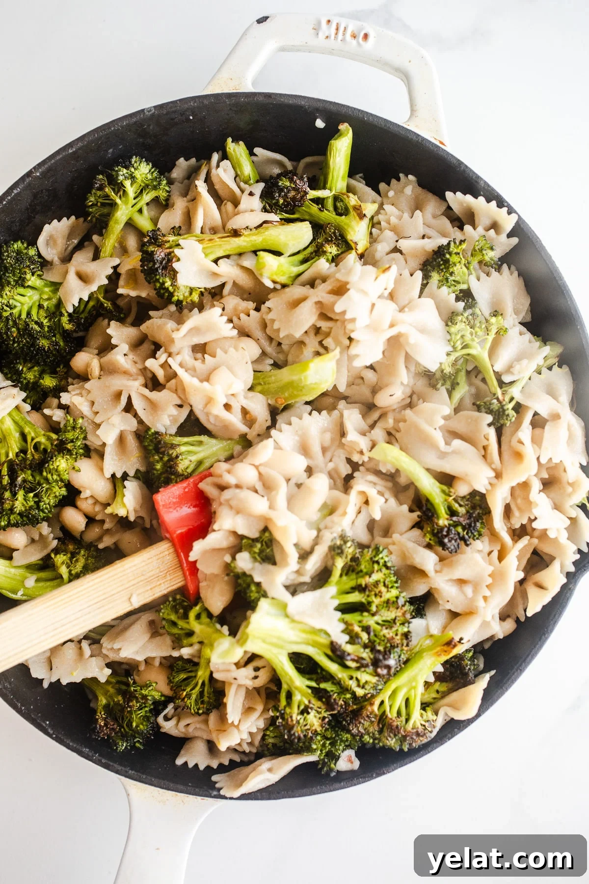 Creamy White Bean Pasta with Garlic and Herbs 6 Pasta and broccoli in a saucepan.