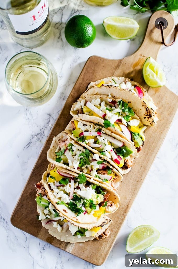 Grilled Salmon Tacos with Avocado Mango Salsa Recipe 2 Cedar grilled salmon tacos with a refreshing avocado mango salsa and homemade corn tortillas. The best thing you will make this summer.