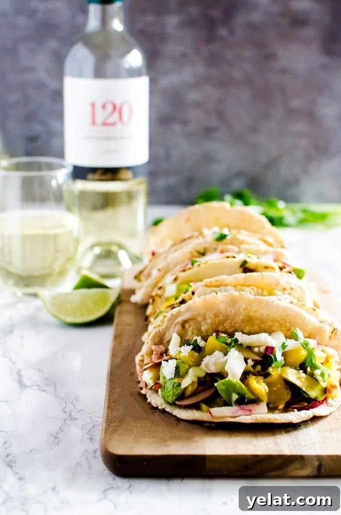 Grilled Salmon Tacos with Avocado Mango Salsa Recipe 4 Salmon tacos with mango avocado salsa recipe. Perfect for your next summer BBQ