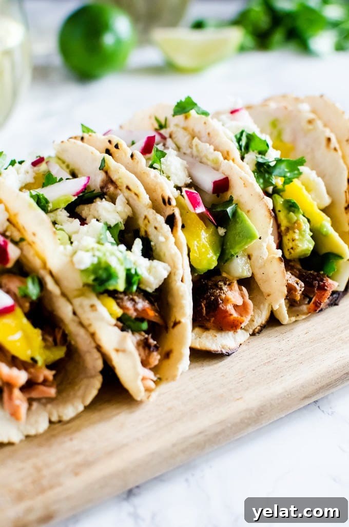 Grilled Salmon Tacos with Avocado Mango Salsa Recipe 6 Grilled salmon tacos with a refreshing avocado mango salsa. If you only make one thing on the grill this summer, it has to be this.