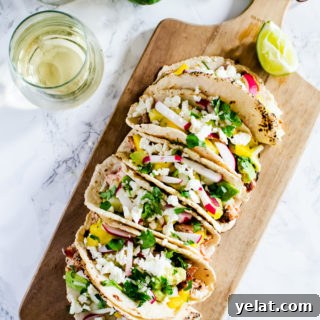Cedar grilled salmon tacos with a refreshing avocado mango salsa and homemade corn tortillas. The best thing you will make this summer.