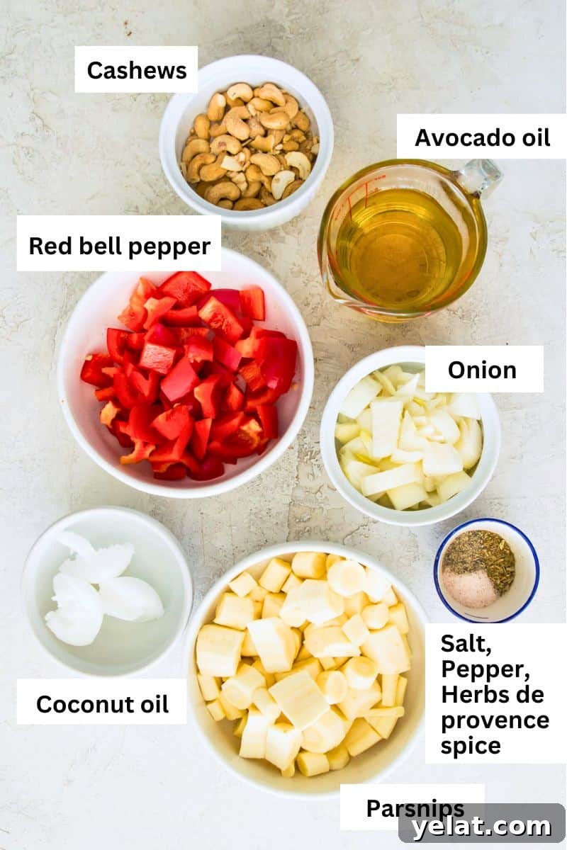 Roasted Red Pepper Cashew-Parsnip Dip (Vegan) 3 The ingredients needed to make a red pepper dip separated into small bowls including red bell pepper, cashews, avocado oil, spices and onion.