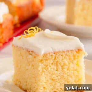 Lemon Sheet Cake Recipe: Zesty, Moist Lemon Cake for Large Groups 15 A slice of lemon sheet cake topped with lemon cream cheese icing.
