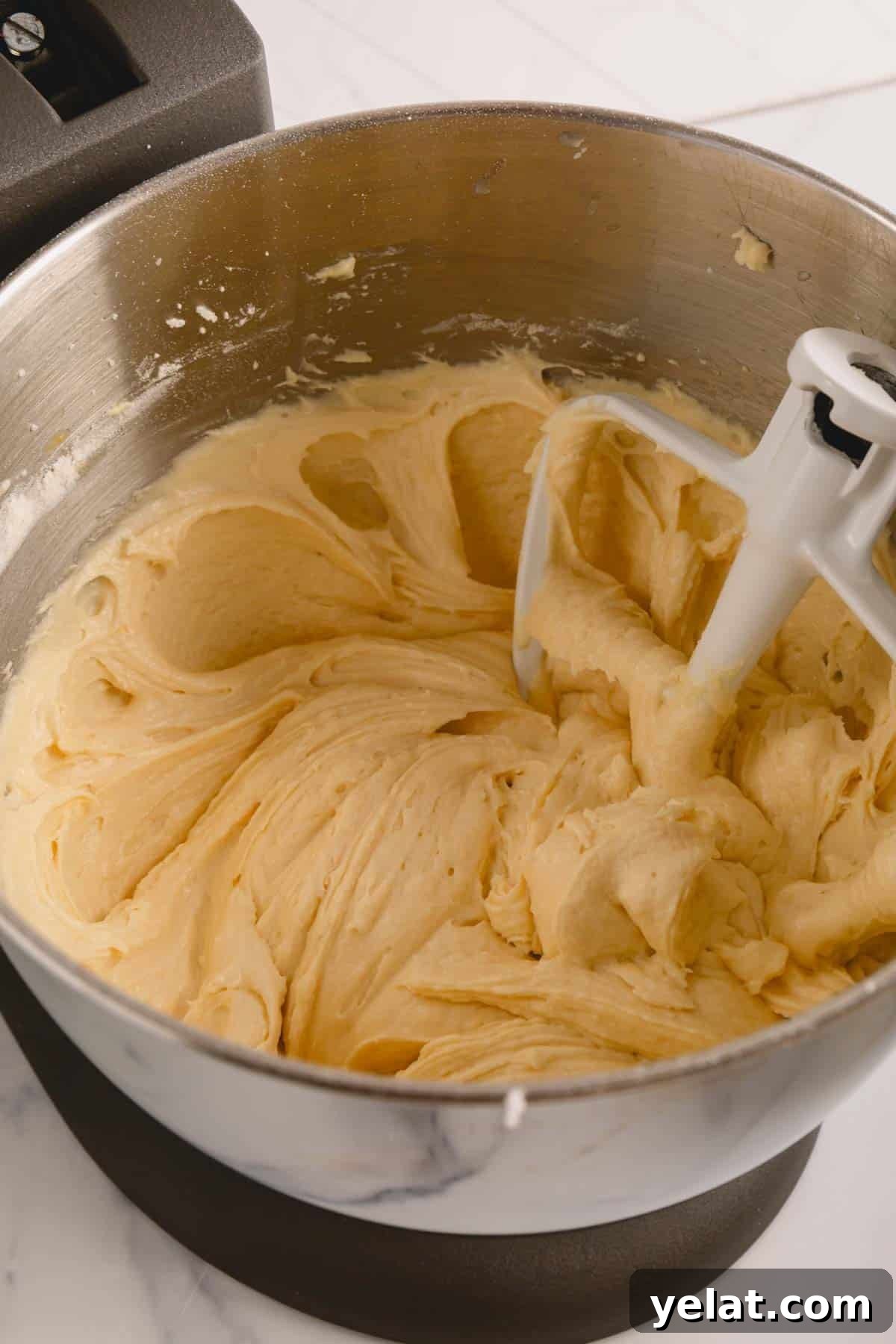 Lemon Sheet Cake Recipe: Zesty, Moist Lemon Cake for Large Groups 8 Lemon sheet cake batter in a stand mixer.
