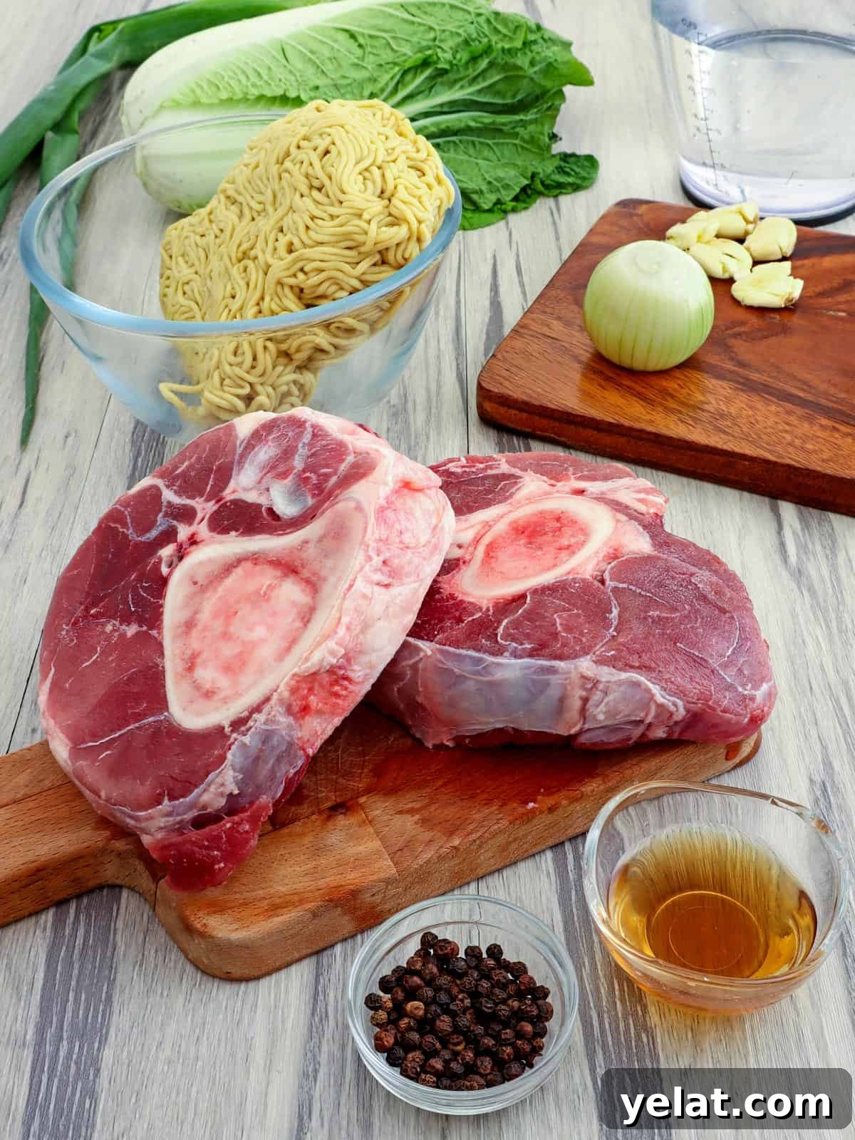 beef shanks, egg noodles, fish sauce, onions, garlic, peppercorns, green onions, napa cabbage