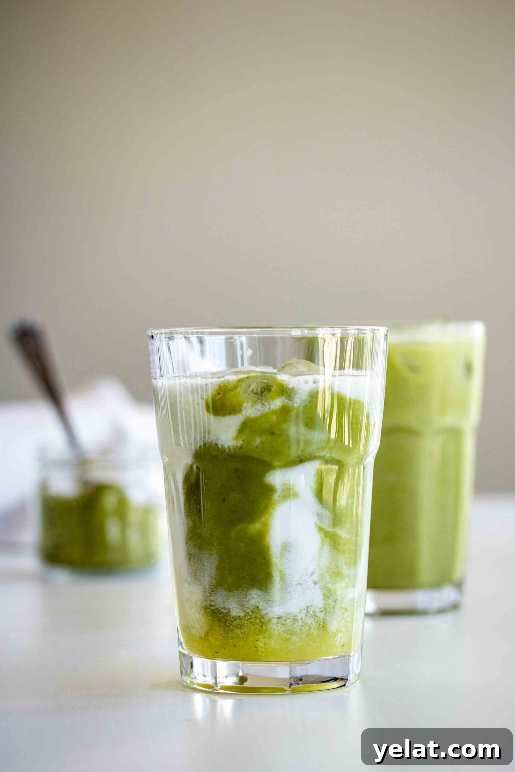 Two glasses of Iced Pineapple Matcha, ready to drink