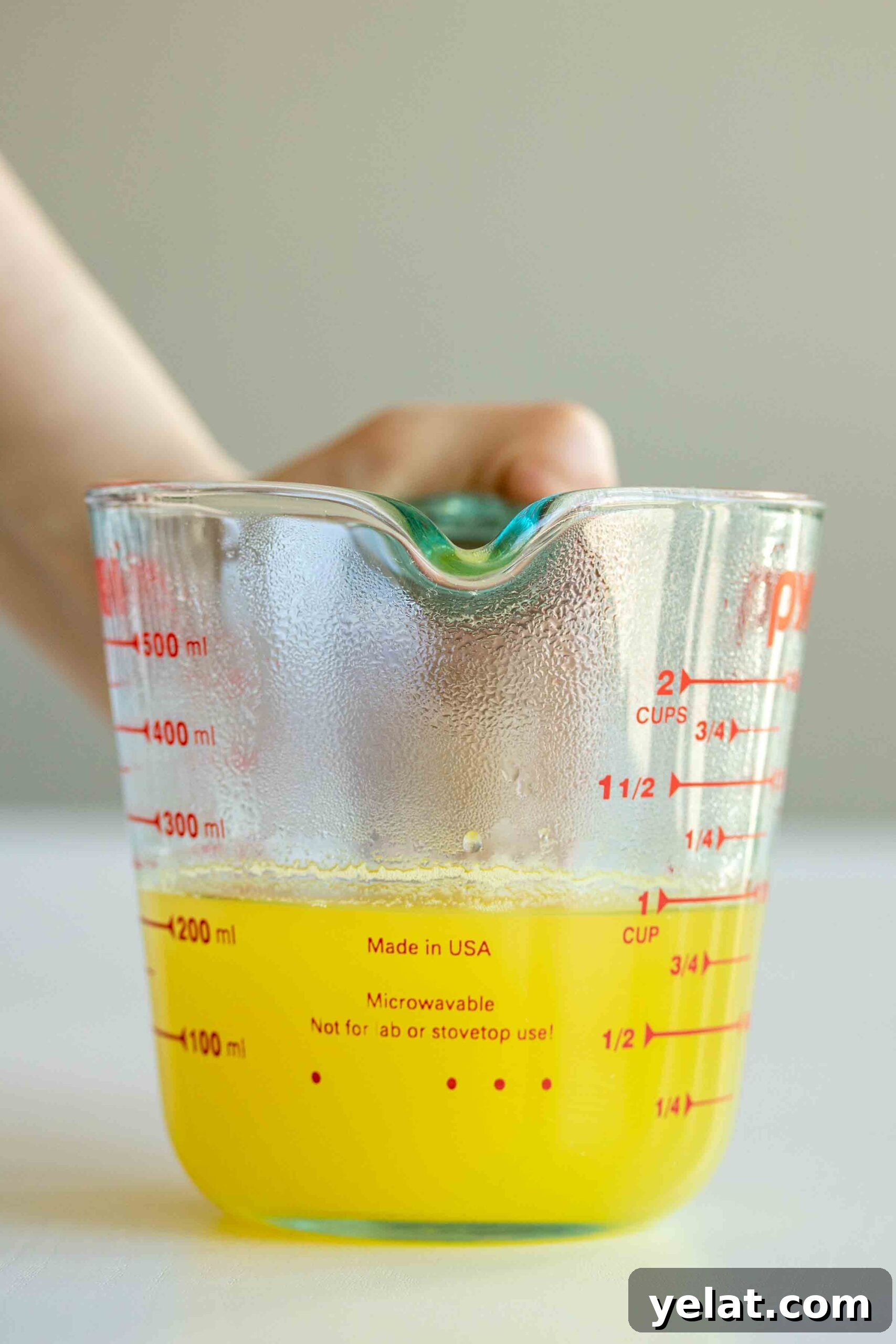 A jar full of pineapple ginger syrup
