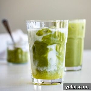 Two glasses of iced pineapple matcha drink