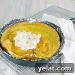 Pumpkin Pie Dutch Baby — Fluffy Autumn Skillet Pancake Recipe 7 Pumpkin Pie Dutch Baby in a cat iron skillet with whipped cream