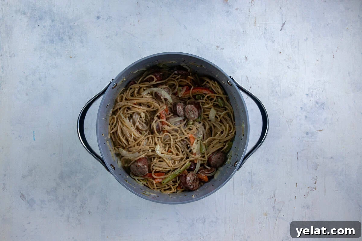 Cajun Sausage Spaghetti Recipe: Spicy Pasta with Andouille 7 Cooked sausage spaghetti with cream cheese stirred in.