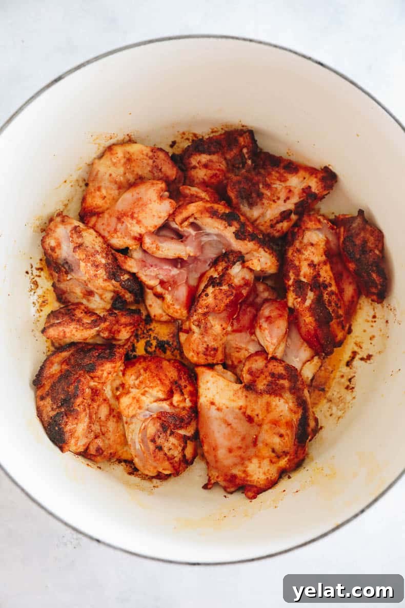 browned chicken thighs in a dutch oven.