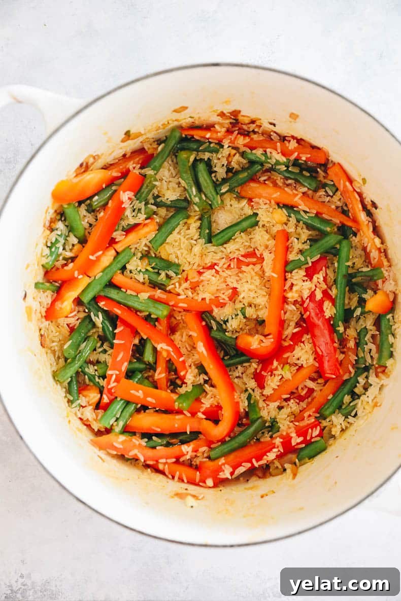 veggies and rice in a dutch oven.
