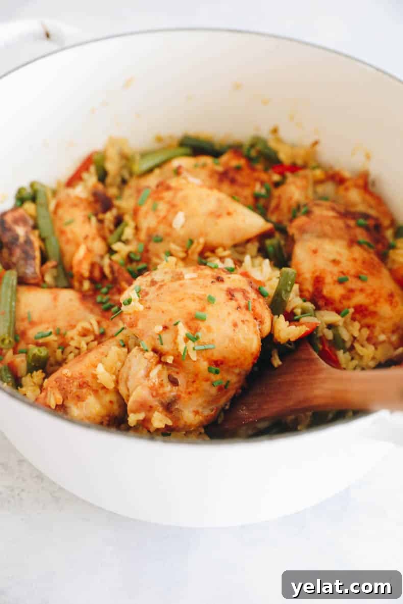 close up image of a chicken thigh in this one pot chicken and rice recipe.