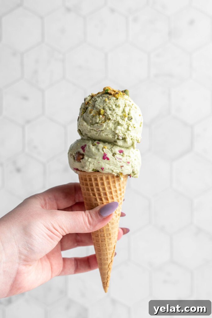 Homemade Pistachio Ice Cream Recipe with Creamy Texture 4 pistachio ice cream scoops in a cone