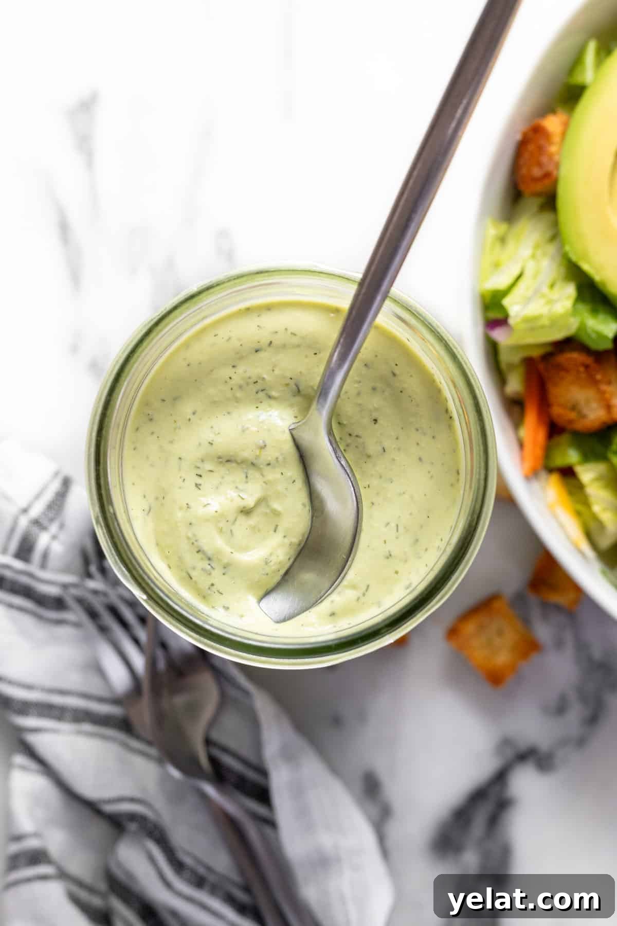 5-Minute Avocado Lime Ranch Dressing (Chick-fil-A Copycat) 2 Wide-mouth mason jar filled with creamy homemade avocado lime ranch dressing.