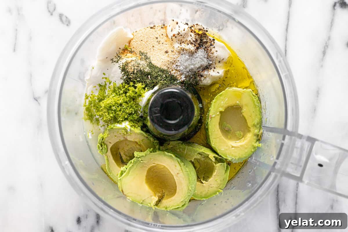 5-Minute Avocado Lime Ranch Dressing (Chick-fil-A Copycat) 4 Food processor filled with ingredients to make avocado ranch dressing.