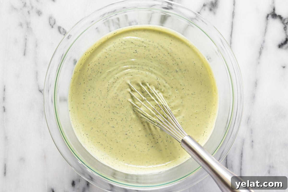 5-Minute Avocado Lime Ranch Dressing (Chick-fil-A Copycat) 5 Big glass bowl filled with creamy homemade avocado ranch dressing.