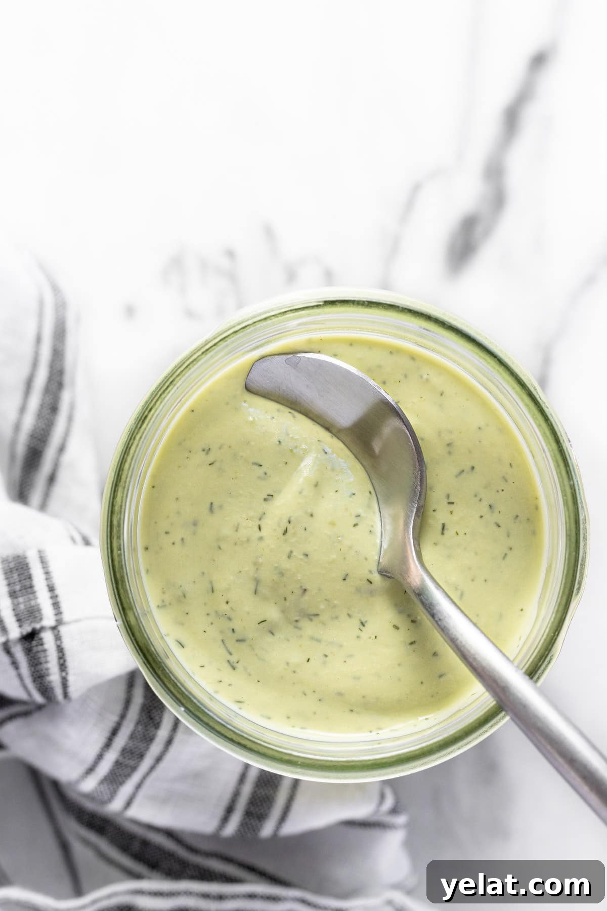 5-Minute Avocado Lime Ranch Dressing (Chick-fil-A Copycat) 6 Wide-mouth mason jar filled with creamy homemade avocado lime ranch dressing.