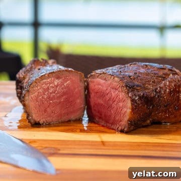 Smoked Picanha Steak on a cutting board with Ninja Woodfire in the background.