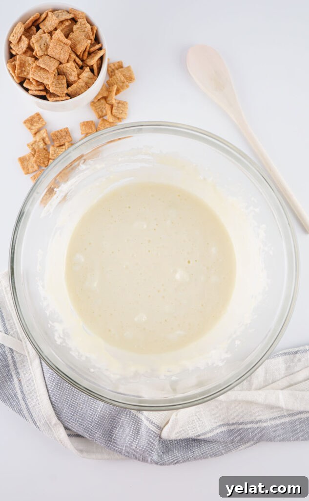 Cinnamon Toast Crunch Marshmallow Bars: Gooey Cereal Treats 5 melted marshmallow and butter in glass bowl