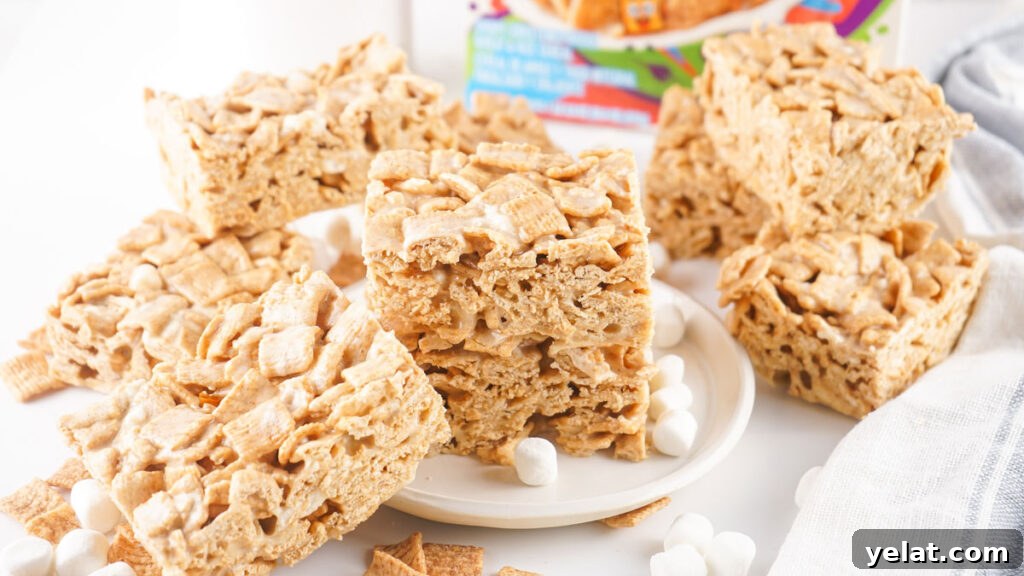 Cinnamon Toast Crunch Marshmallow Bars: Gooey Cereal Treats 8 cinnamon toast crunch treats on plate