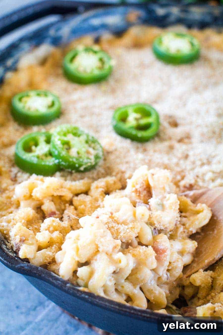Smoked Jalapeno Popper Mac and Cheese on spoon in skillet