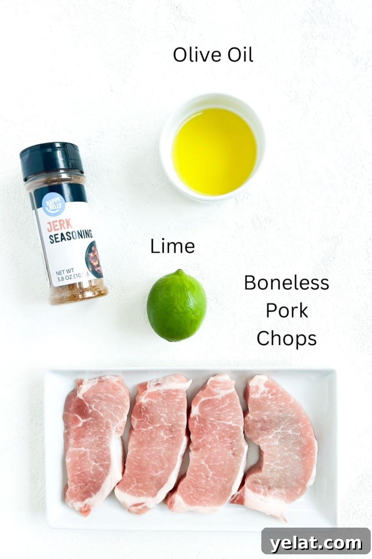 Crispy Oven-Baked Boneless Pork Chops with Garlic Herb Rub 3 Four boneless pork chops, olive oil, one lime, labeled and a container of jerk seasoning on a white background.