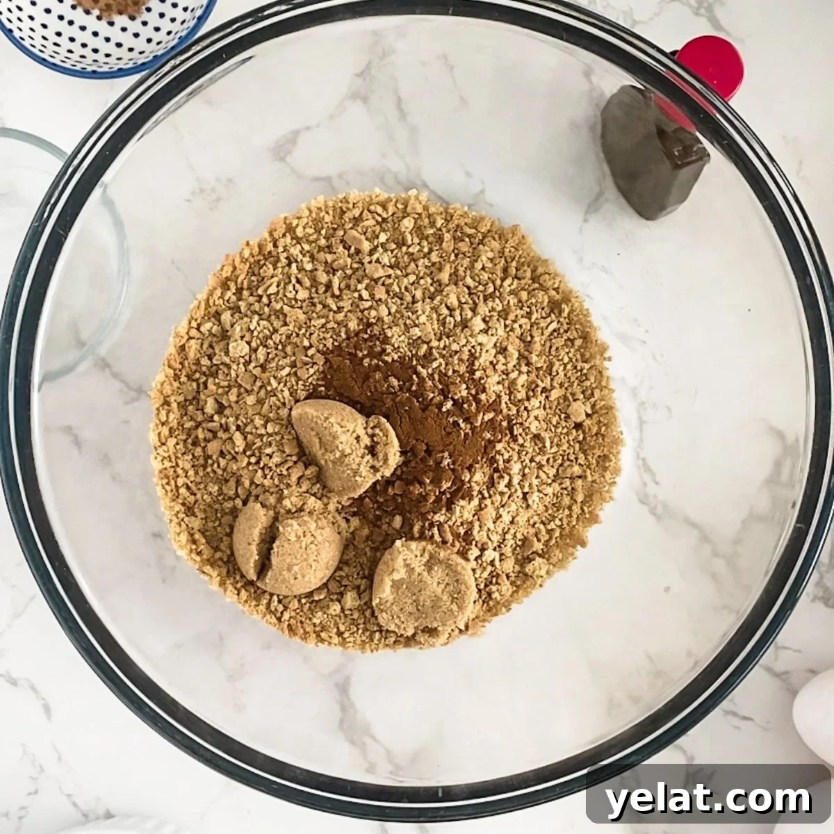 Paula Deen’s Pumpkin Cheesecake Recipe: Southern-Style Dessert Guide 4 graham crackers, cinnamon and brown sugar in a bowl.