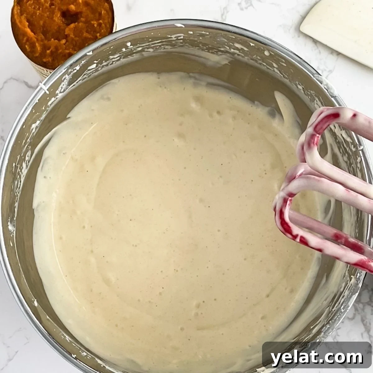 Paula Deen’s Pumpkin Cheesecake Recipe: Southern-Style Dessert Guide 8 cheesecake filling in a bowl.